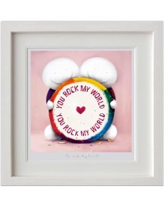 An image of two Doug Hyde created characters holding a sweet, known as a rock stick, that has been cut to reveal the words 'YOU ROCK MY WORLD - THE HYDE FAMILY'. Both characters are smiling and the background is pink. This print also has a white frame.